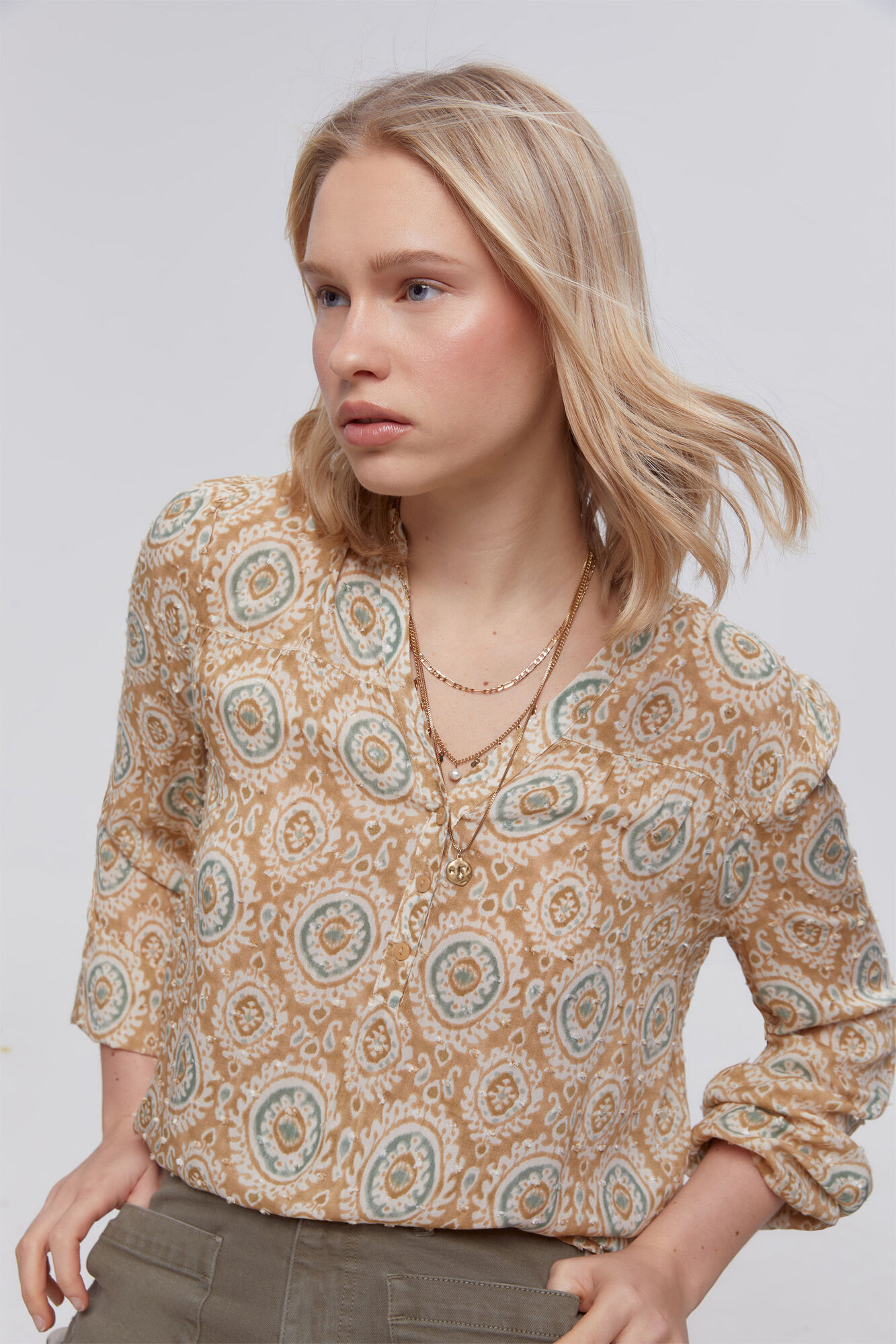 Milano Blusa plumeti estampada
